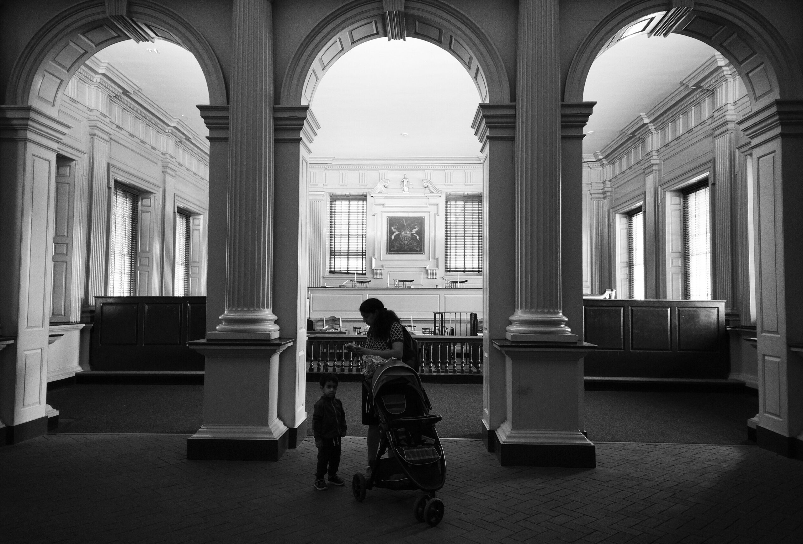 Bella the retired guide dog reading with children at a library