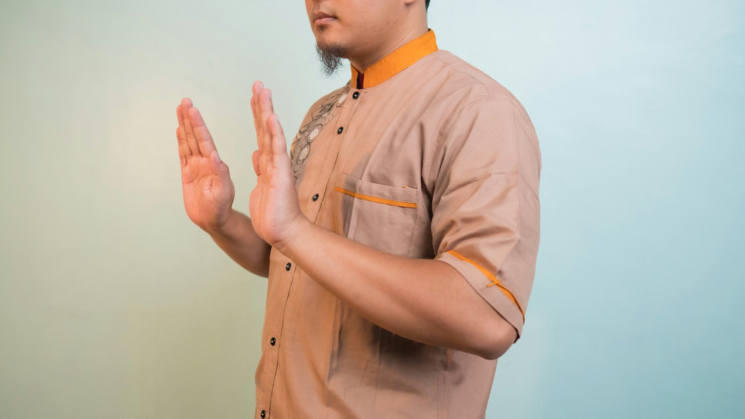 Trainer demonstrating proper posture and hand signals alongside verbal cues.